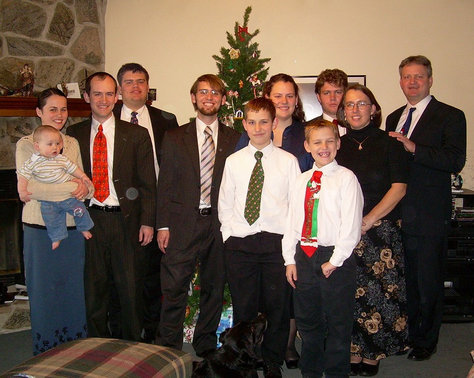 Kendall Pack's family in front of the Christmas tree. 