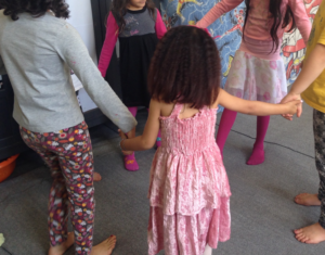 Children dance in a circle