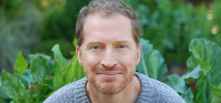 A headshot of Andrew Greer.